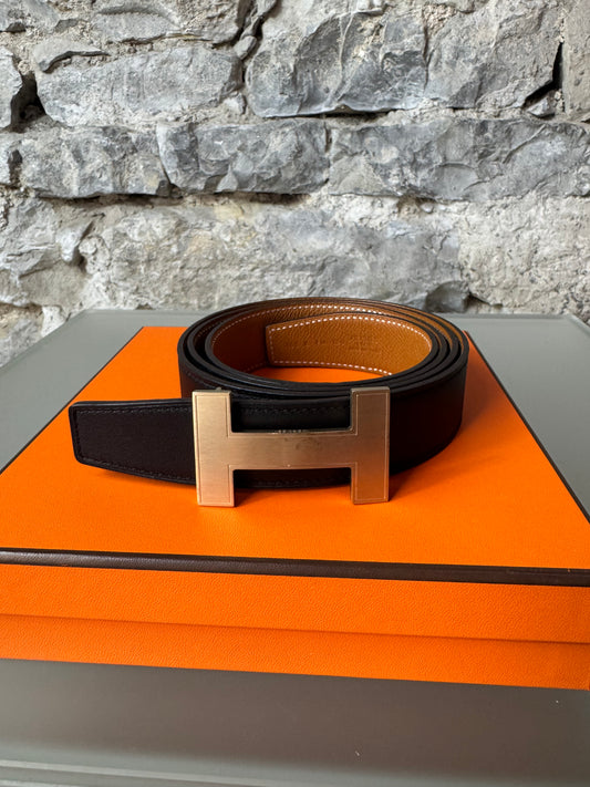 Hermès Wendegürtel – Schwarz/Braun mit goldfarbener H-Schnalle