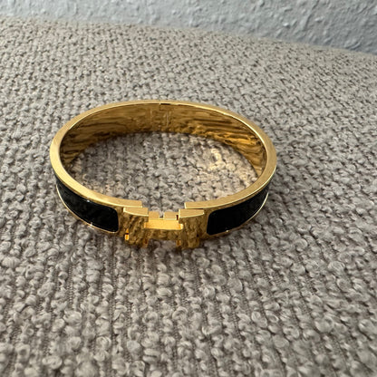 Hermès Clic H Armreif – Gold / Schwarz