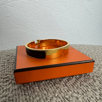 Hermès Clic H Armreif – Gold / Schwarz