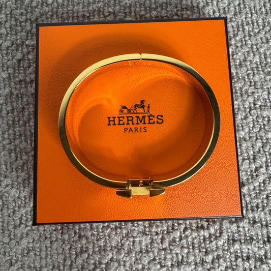 Hermès Clic H Armreif – Gold / Schwarz