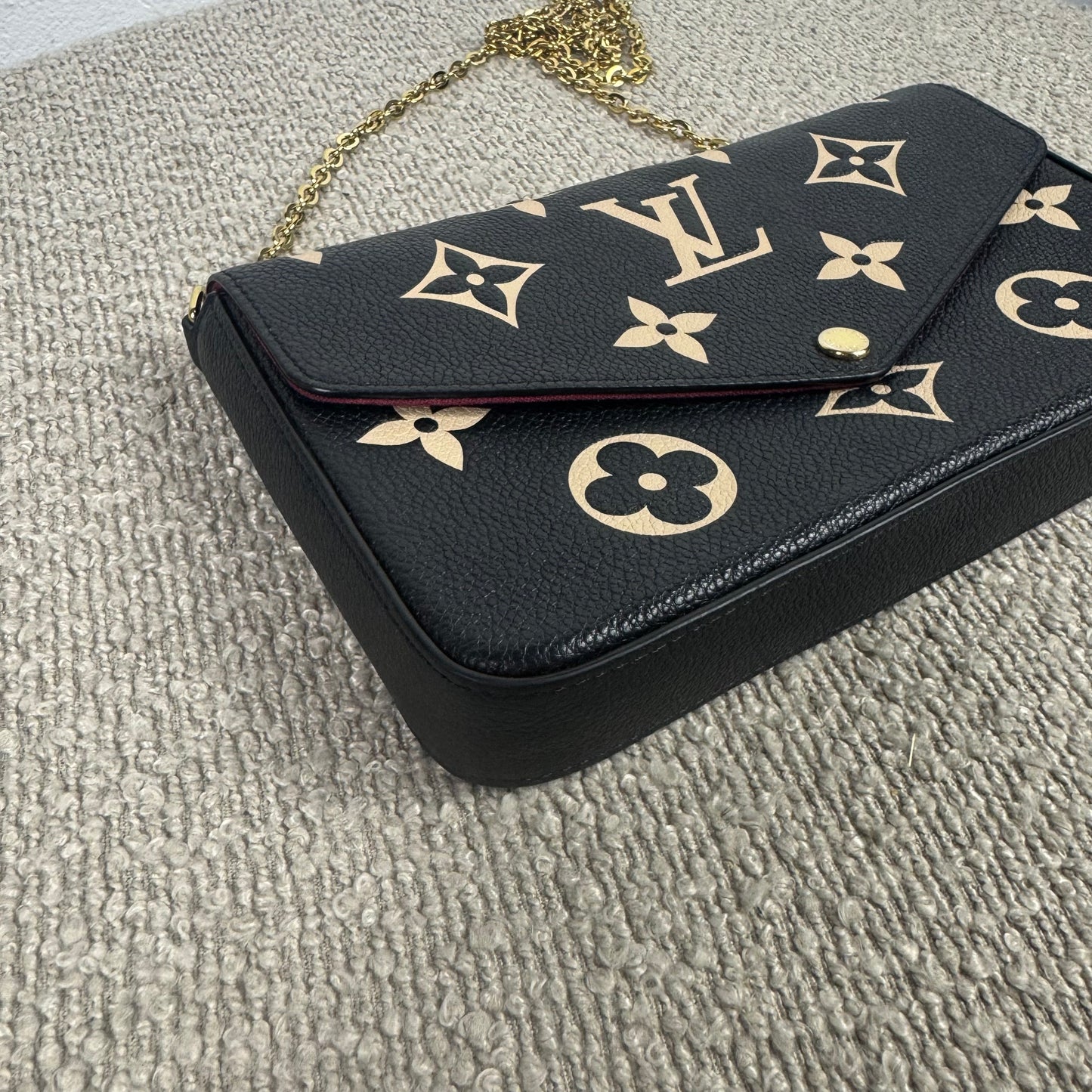 Louis Vuitton Félicie Pochette – Empreinte Leder Schwarz / Beige