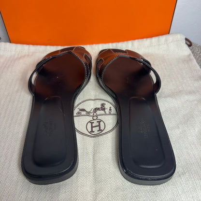 Hermès Oran Sandalen, schwarzes Kalbsleder Gr. 39,5