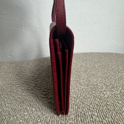 Gucci Microguccissima Geldbörse mit Riemen – Rot